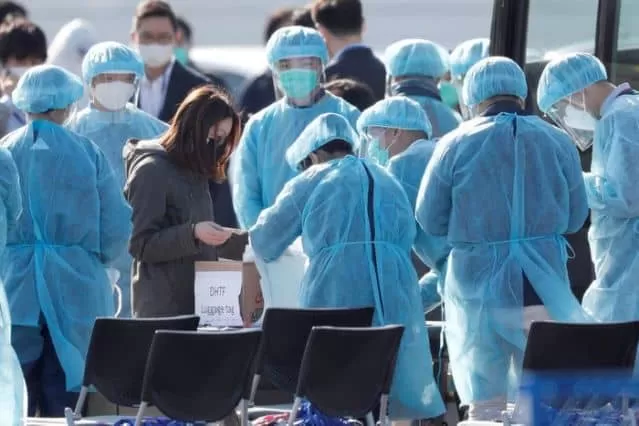 Japan announces four more cases of virus, to close a two-day school