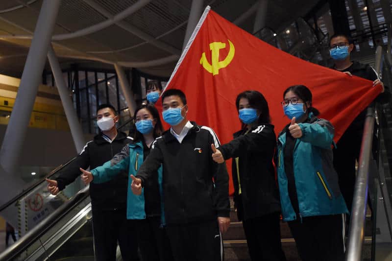 Wuhan reports no new infections for first time, imported cases surge
