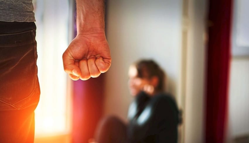 Man beating up his wife illustrating domestic violence