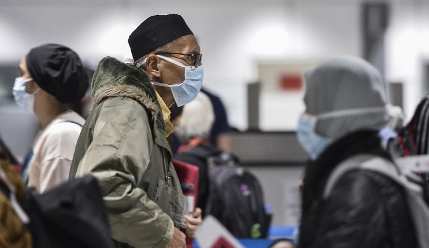 Passengers wearing safety masks in Airport