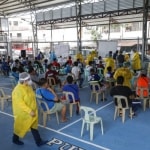 Resident wait Residents wait for their turn during a mass testing for COVID-19 in Manila