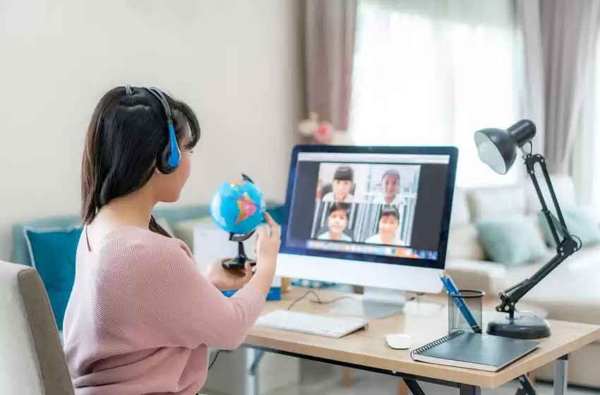 Asian Teacher teaches via video conference for Online class