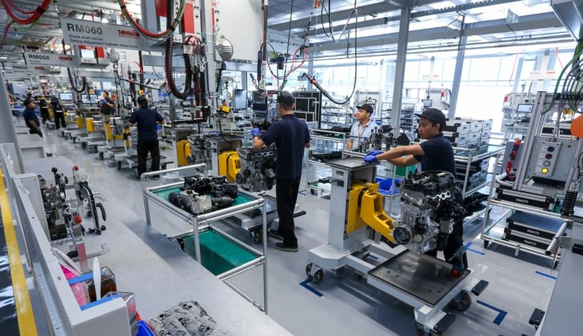 South East Asia Workers at engine assembly plant