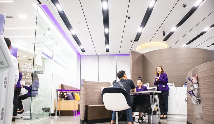 Bank employees are explaining to customers in the office at Central