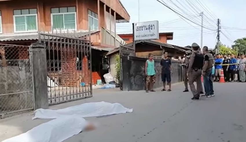 two men lying on the road dead with bullet wounds