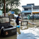 A Malaysian MP clarifies remarks about how floods might be used to promote 'volunteer tourism'