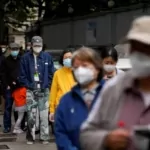 As COVID-19 infections grow, Macao locks down buildings