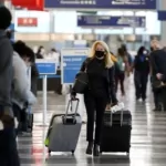 COVID-19 numbers climb, Pakistan requires masks for domestic flights