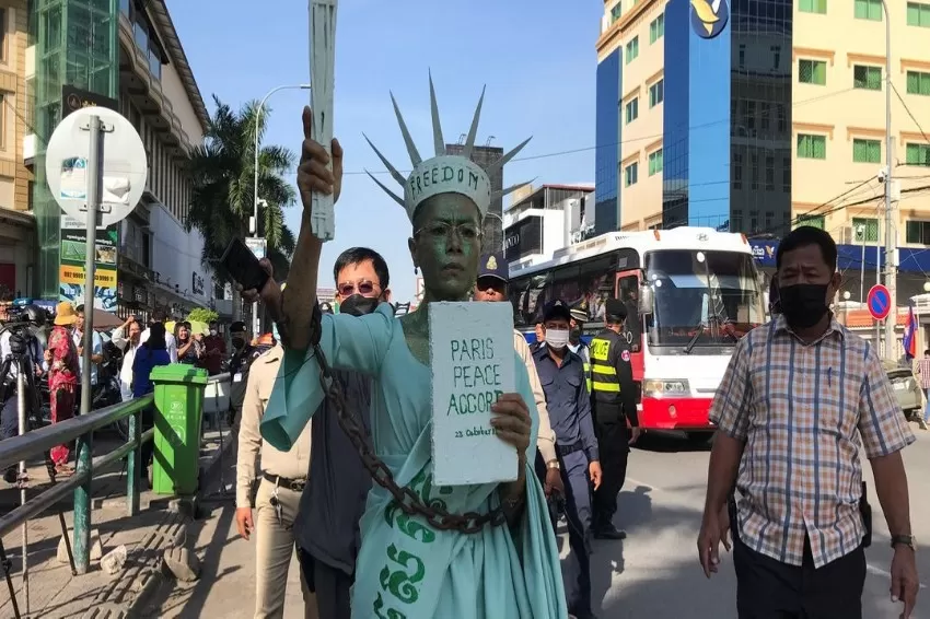 Cambodian court imprisons an American lawyer and dozens of others for treason