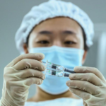 China insists COVID-19 vaccines are safe and shows leaders got injections