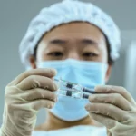 China insists COVID-19 vaccines are safe and shows leaders got injections