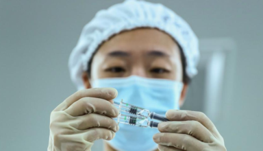 China insists COVID-19 vaccines are safe and shows leaders got injections