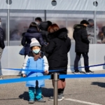 South Korea's PM warns of a COVID-19 outbreak as cases soar