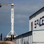 Test-fired SpaceX rocket booster catches fire
