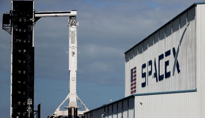 Test-fired SpaceX rocket booster catches fire