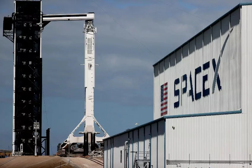 Test-fired SpaceX rocket booster catches fire