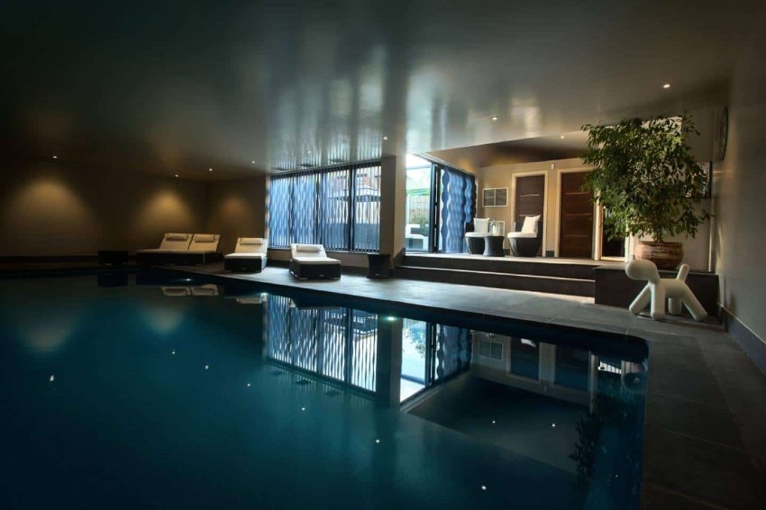 The owners' 'office' is a heated pool in the basement of their Singapore home