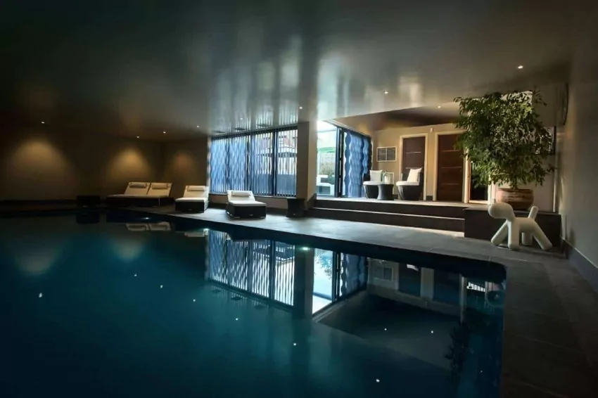 The owners' 'office' is a heated pool in the basement of their Singapore home