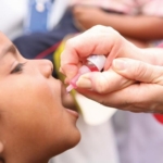Why has polio spread to London, New York, and Jerusalem?