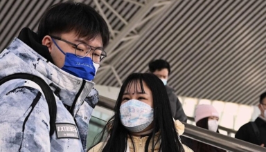 china says covid 19 epidemic reducing before travel rush