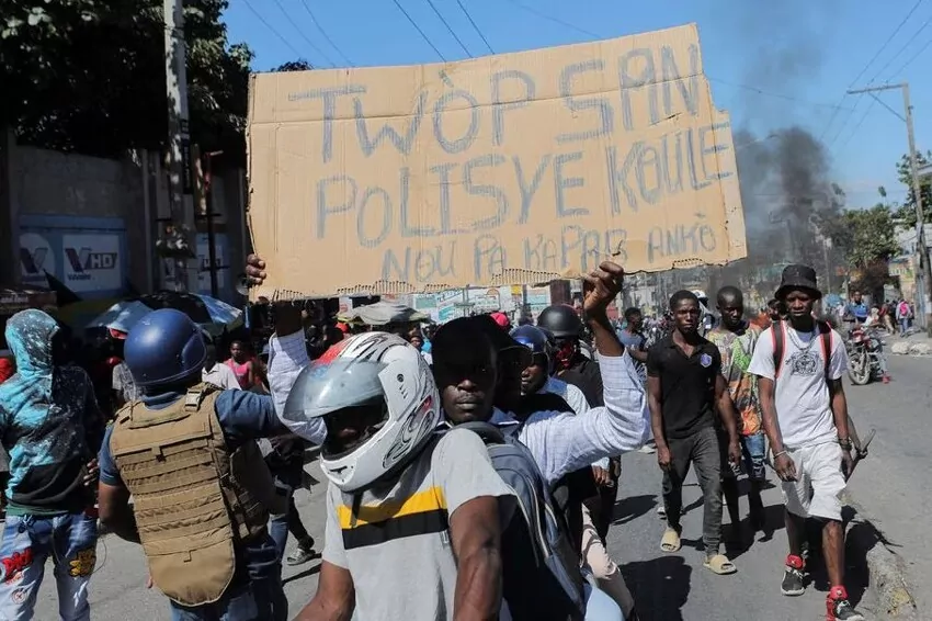 To protest officer deaths, Haiti police block roadways and breach into airports