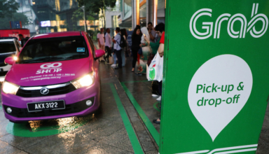 a grab pick up and drop off station is seen at the entrance of kuala lumpur city centre in kuala lumpur