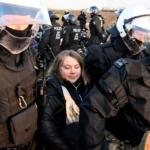 greta thunberg detained by norwegian police during a protest