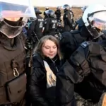 greta thunberg detained by norwegian police during a protest
