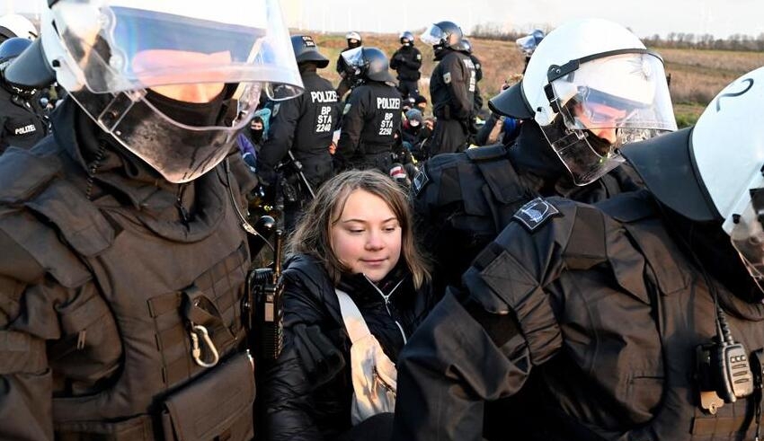 greta thunberg detained by norwegian police during a protest
