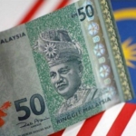 are malaysia's ringgit and singapore dollar making history with their currency battle