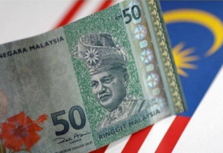 are malaysia's ringgit and singapore dollar making history with their currency battle