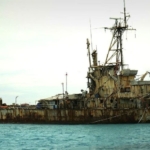 china on tuesday repeated its call for the philippines to remove a warship from a disputed shoal, after manila strongly stressed it would not abandon the area.