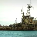 china on tuesday repeated its call for the philippines to remove a warship from a disputed shoal, after manila strongly stressed it would not abandon the area.