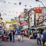 chinese tiktoker faces backlash for throwing money at thai locals