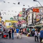 chinese tiktoker faces backlash for throwing money at thai locals